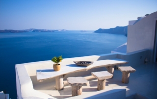 Greek table and view from Santorini to sea